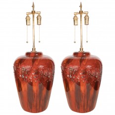Pair of red glazed pottery lamps