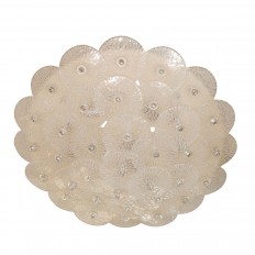 Circular flush mount fixture composed of round glass elements